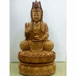 hand-carved wooden bodhisattva statue