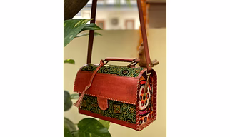 handbags of textiles or silk, leather