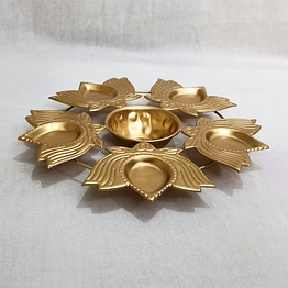 premium diya shape gold plated flower urli bowl with wax tealight candle holder for home and office decor, handicrafted bowl and tealight candles diwali decoration