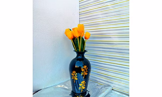 Metal flower vase with golden leave