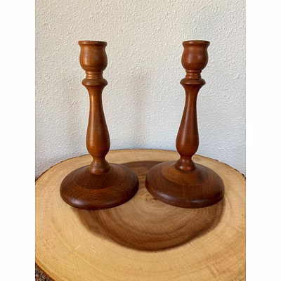 "artisanal wooden candle stand – sturdy base, decorative carvings, ideal for centerpieces"