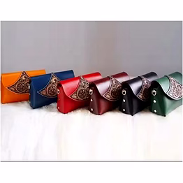 handcrafted genuine leather tooling women’s sling bag with floral embossed flap, chain strap and compact design