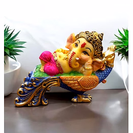 playful baby ganesha on peacock statue