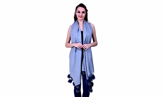 Light Blue Woolen Scarf with Pom-Pom Tassel Detailing Draped Over Casual Ensemble