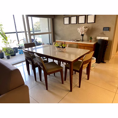 six seater dining table of teak wood