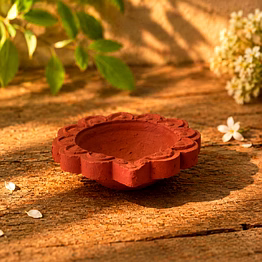 deep red terracotta diya