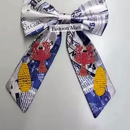 hand-beaded crawfish season bows for event retailers