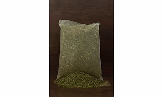 Cow dung powder, compressed/formulated as eco‑brick