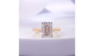EMERALD ELEGANCE - TRC0173ABLR - a 5 carat emerald cut lab grown diamond studded in pure 18kt gold finished in yellow gold color