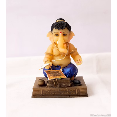 handcrafted table top baby ganesh as writer