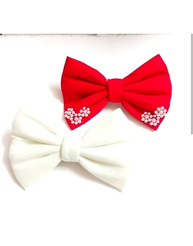 white and red pearl bow