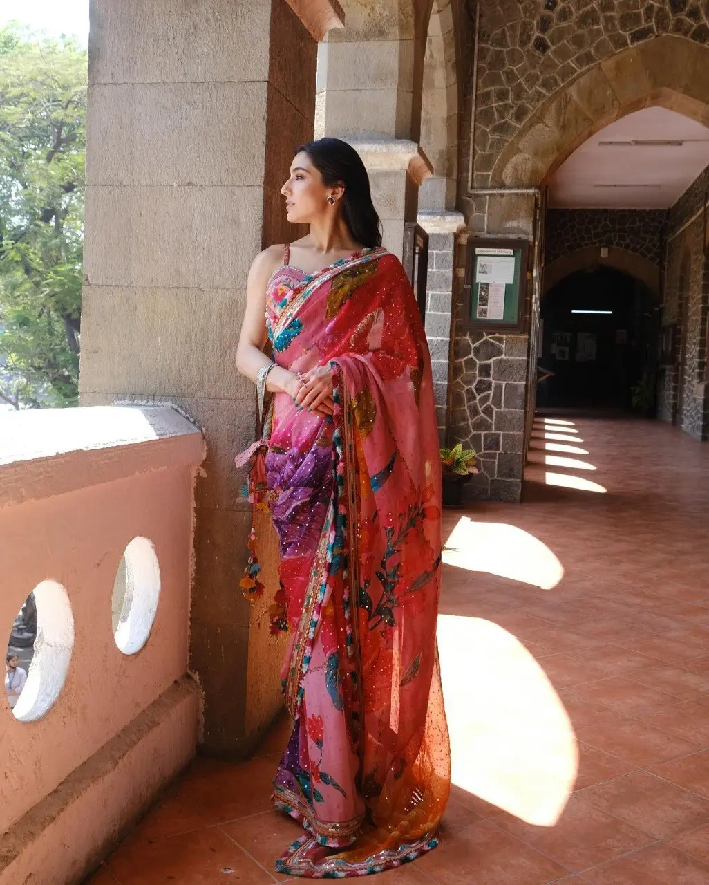 A model gracefully draped in a Sara Ali Khan Inspired Floral Chiffon Saree by Shiv Textiles, highlig