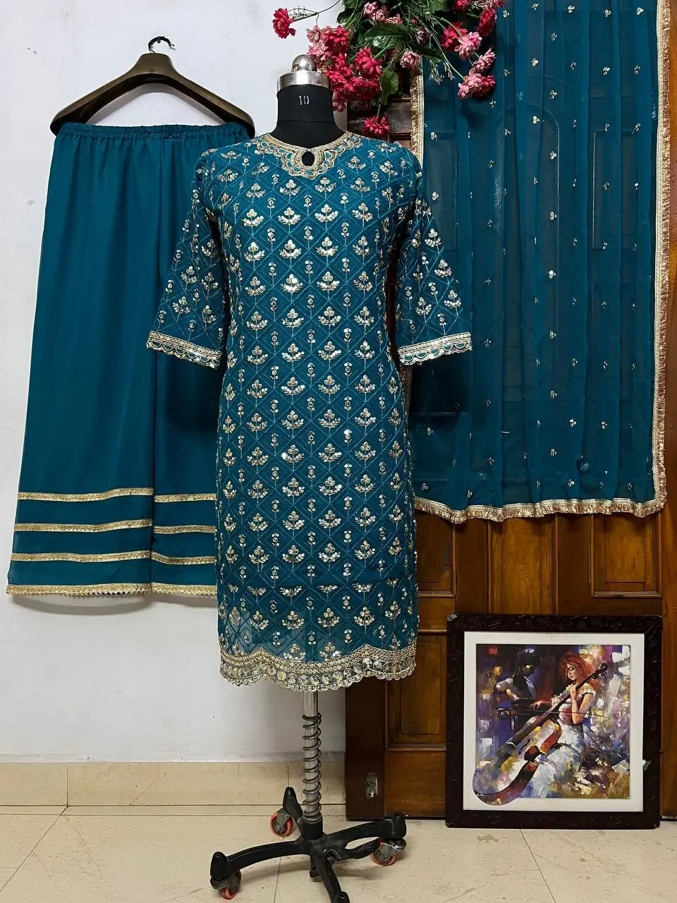 Long georgette kurti with beautiful sequin embroidery work paired with a georgette palazzo set by Sh