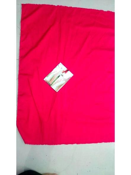 A graceful woman adorned in a cream georgette saree, beautifully embroidered in red and white.