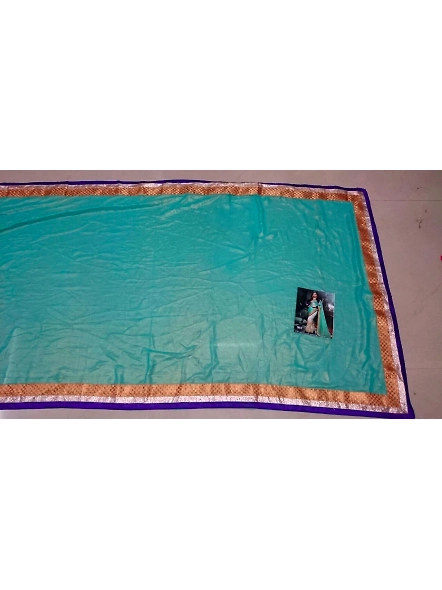 Beautiful blue and green embroidered georgette sari, complemented by a matching blouse, ideal for sp