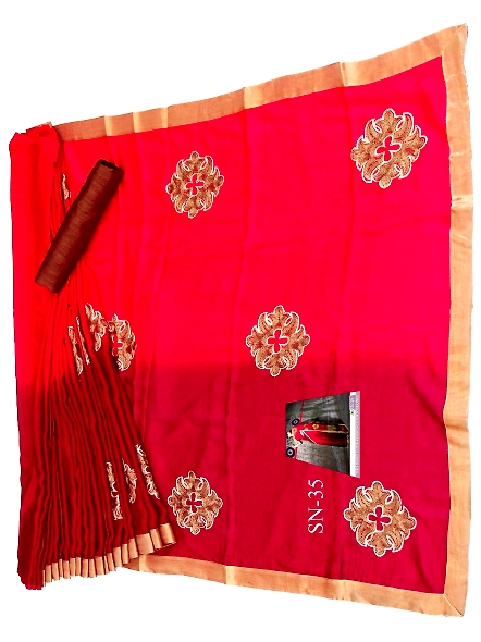 A woman wearing a red sari made of Georgette and silk stands next to a wall, highlighting her stylis
