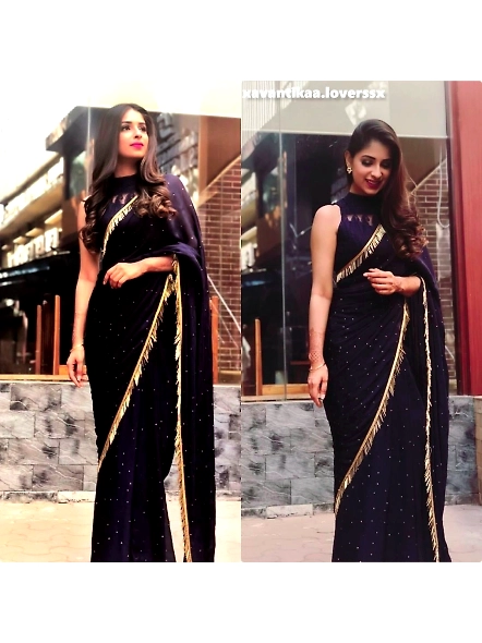 Navy blue georgette saree paired with a gold blouse, designed for elegant partywear.