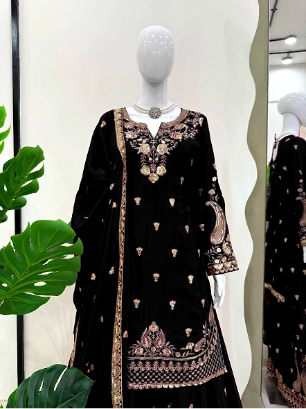 Chic black Chinon silk lehenga suit adorned with beautiful gold embroidery, perfect for festive occa