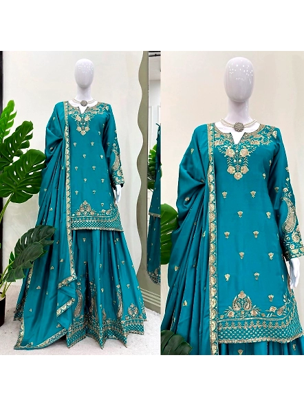 Cyan embroidered suit with intricate gold detailing, made from luxurious brown Chinon silk.