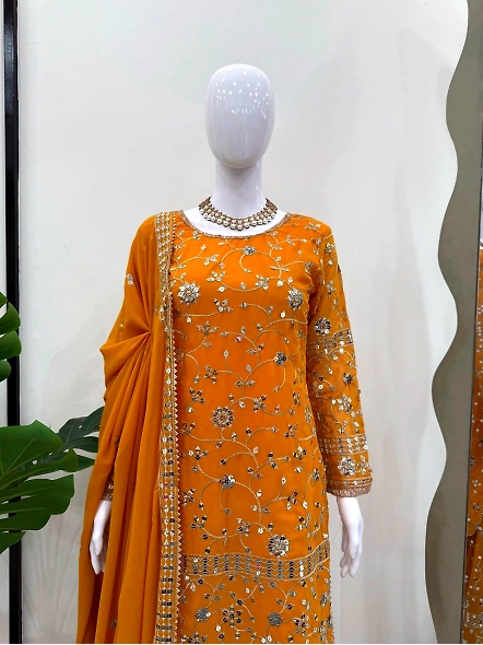 Beautiful yellow lehenga suit made of Georgette, adorned with embroidery and paired with a stylish d