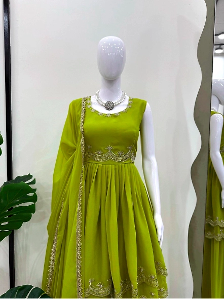 Indian-style green gown in parrot color, adorned with exquisite embroidery, designed as a palazzo su
