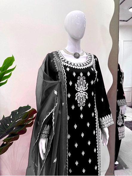Stylish black embroidered suit with delicate white chikan work on Roman silk.