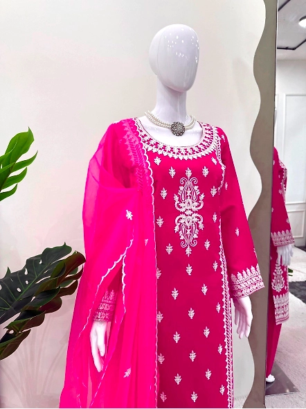 Chic pink suit with white chikan embroidery, made from luxurious Roman silk.