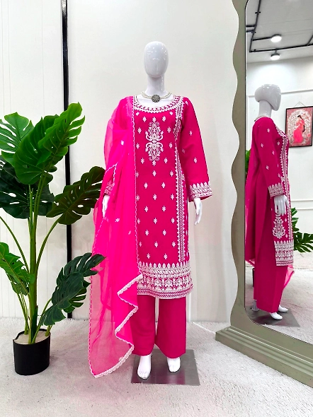 Pink Roman silk suit featuring intricate white chikan embroidery.