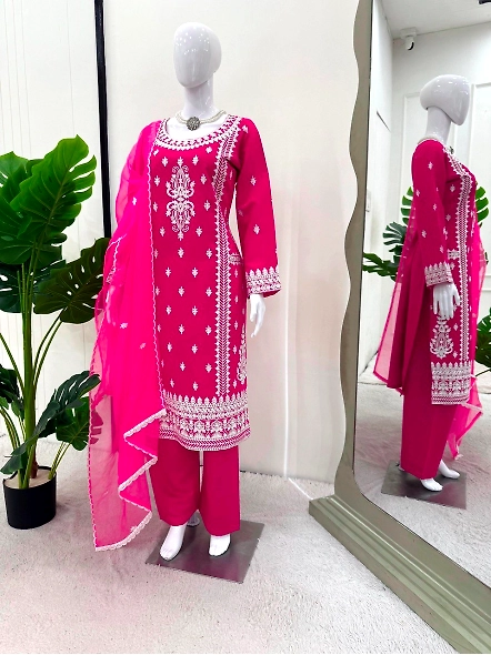 Beautiful pink embroidered suit with delicate white chikan details.