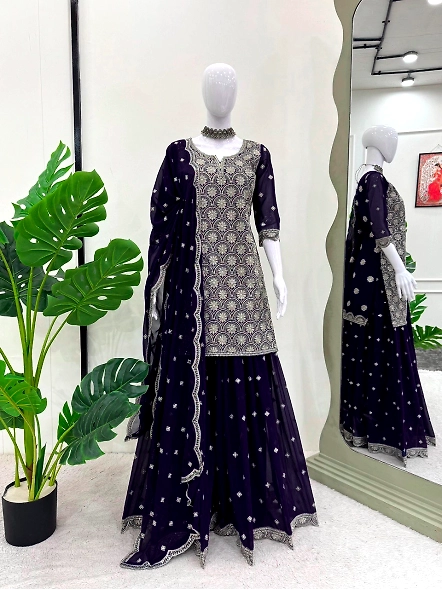 Elegant navy blue embroidered lehenga suit paired with a beautifully draped dupatta, showcasing trad