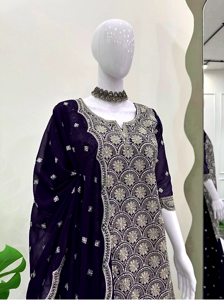 Exquisite navy blue lehenga suit adorned with embroidery, paired with a stylish dupatta for a comple