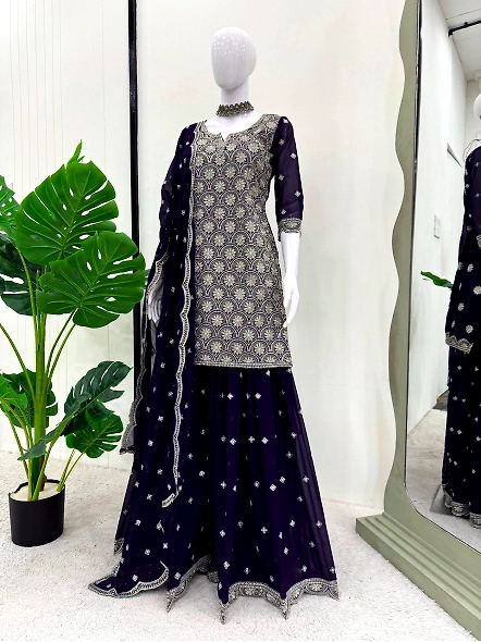 Navy blue lehenga suit featuring detailed embroidery, accompanied by a flowing dupatta for a sophist