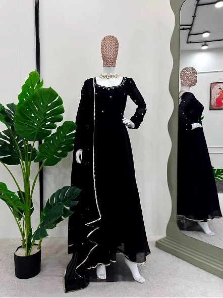 Black georgette anarkali suit featuring intricate gold embroidery throughout the design.