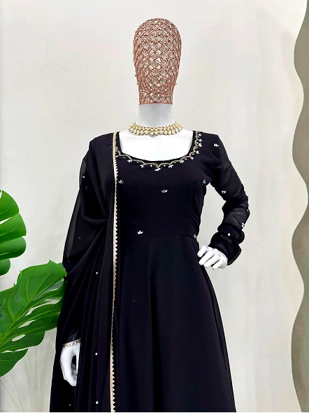 Black georgette salwar suit with stunning gold embroidery, showcasing traditional anarkali style.