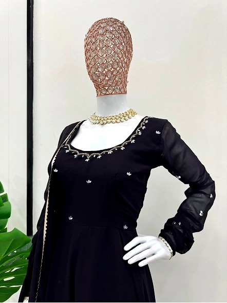 Traditional black anarkali suit in georgette fabric, embellished with exquisite gold embroidery.