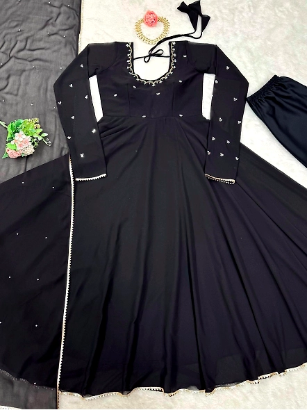 Black georgette anarkali suit highlighted by beautiful gold embroidery, perfect for formal occasions