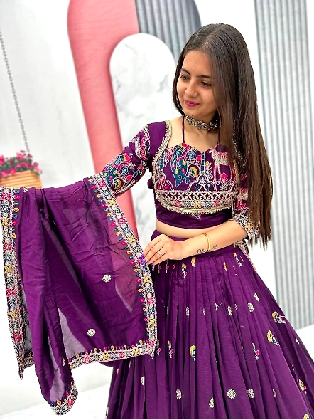 Elegant purple lehenga choli with intricate embroidery, featuring a royal blue Vichitra design for a