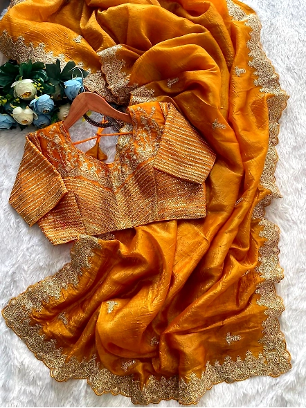 Premium crunchy yellow sari with intricate sequence detailing, highlighting its beauty and elegance