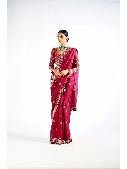 red saree with mirror work border