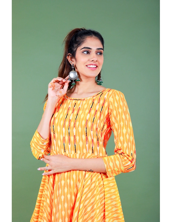 Golden yellow semi silk ikat dress with a handkerchief hem: LD500C-M-2