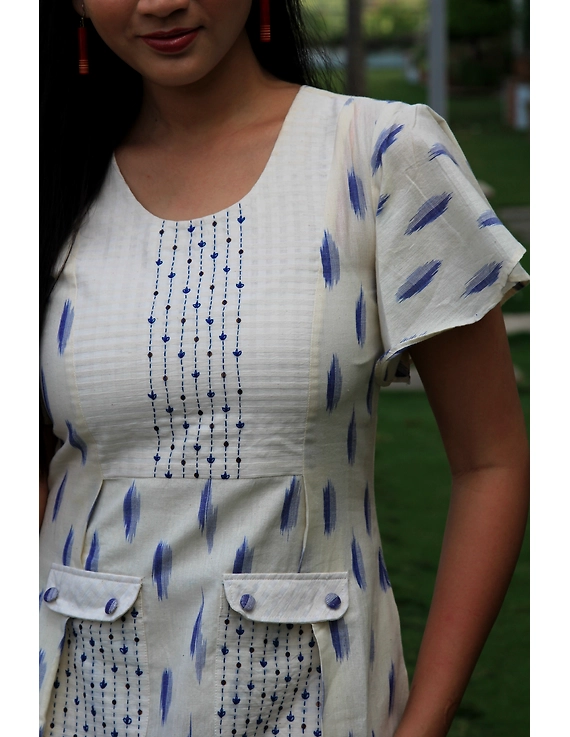 WHITE IKAT PLEATED DRESS WITH EMBROIDERED POCKETS AND YOKE: LD550C-S-4