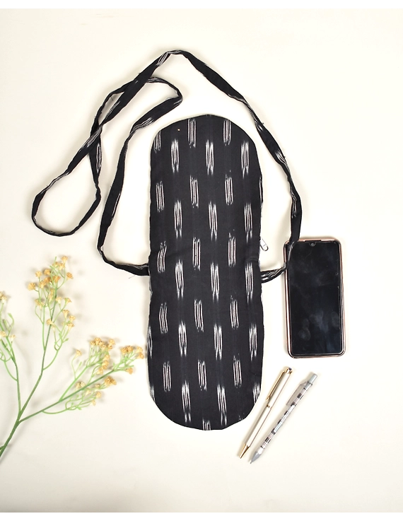 Multi-pocket sling bag in Black ikat cotton: CPI01ED-2