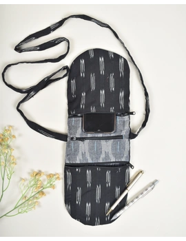 Multi-pocket sling bag in Black ikat cotton: CPI01ED-1-sm