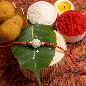 Handmade Beaded Pearl Golden Rakhi for Men and Boys with Roli Chawal