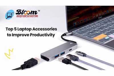 A laptop with a connected USB hub and multiple cables, showcasing essential laptop accessories to im