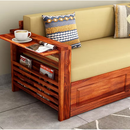 &quot;Close-up view of Futon’s teakwood armrest with built-in magazine rack and tray top, styled wit