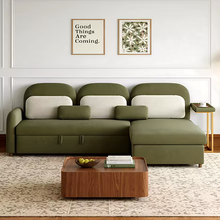 Front view of green sofa cum bed with cushions and gold side stand – Woodkraft Studio