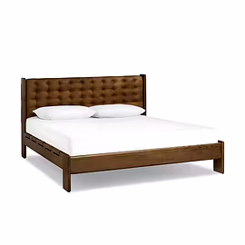 Master Teakwood bed with handcrafted teak frame and brown upholstered headboard – angled view.