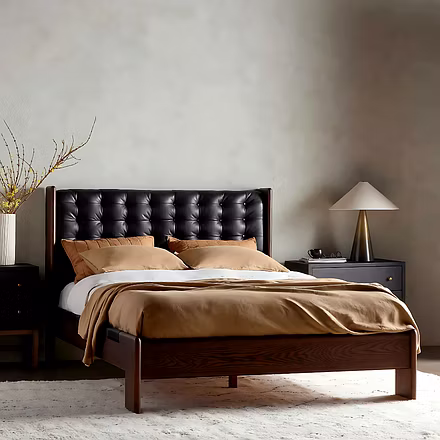Handcrafted Master Teakwood bed styled in modern bedroom with nightstands and beige bedding.