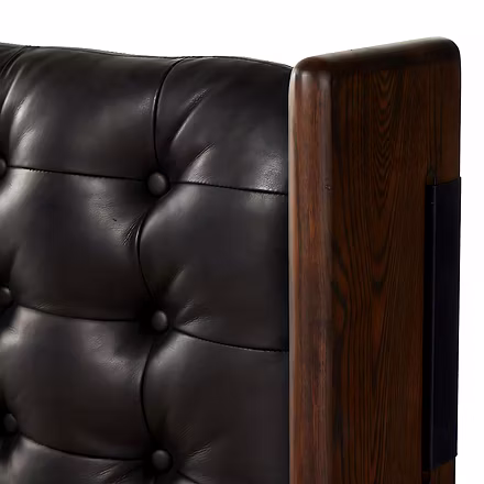 Detailed corner view of handcrafted teak frame and upholstered headboard on Master Teakwood bed.